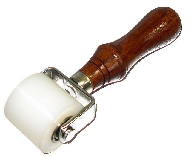 Rouleau presseur cuir